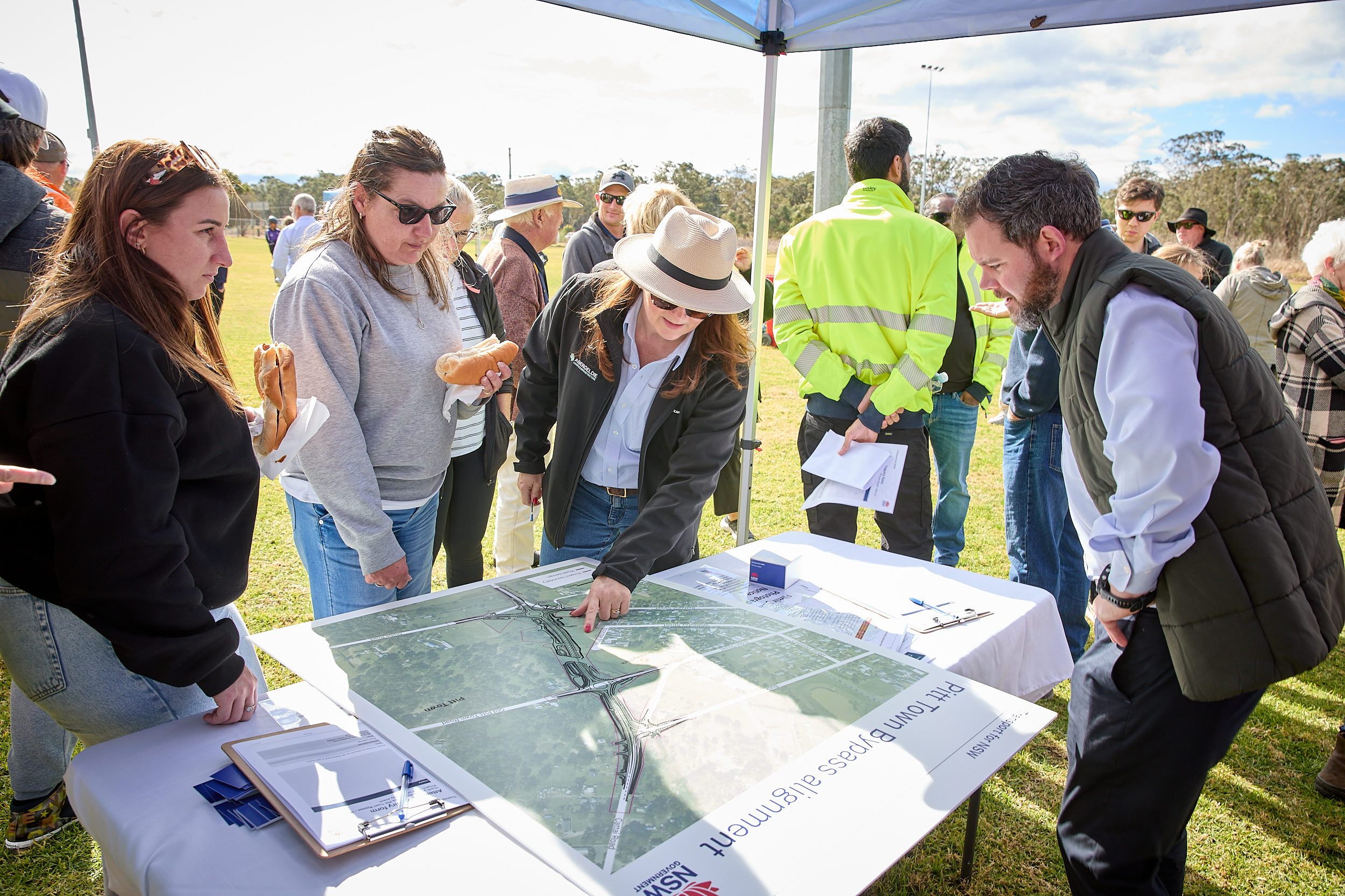 Abergeldie staff explaining details of the Pitt Town Bypass to locals at the community BBQ